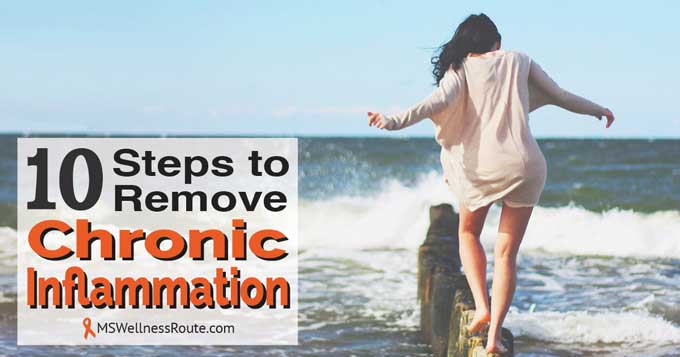 Woman walking on old wooden sand fence post in ocean near the shoreline with overlay: 10 Steps to Remove Chronic Inflammation