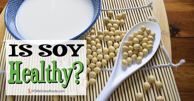 Soybeans on mat with bowl of milk with overlay: Is soy healthy?