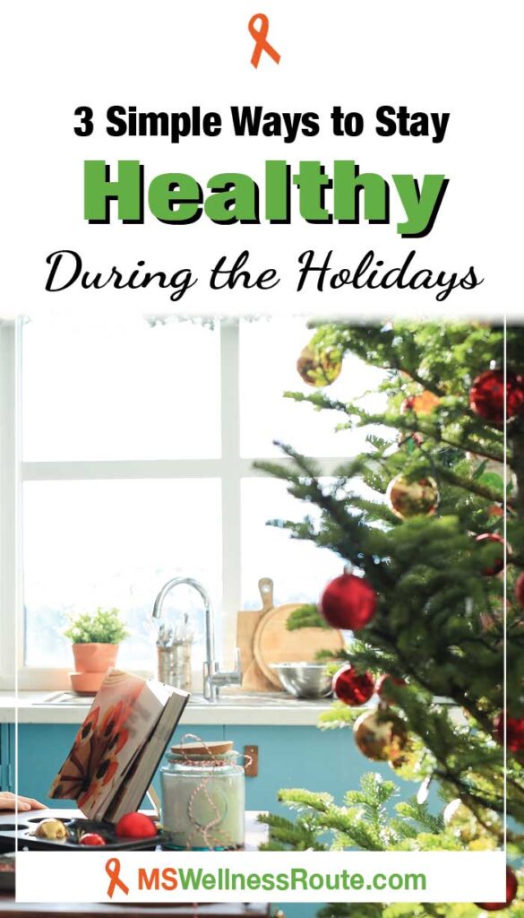 Opened cookbook on table with Christmas tree in kitchen with headline: Ways to Stay Healthy During the Holidays