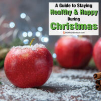 Red apples and cinnamon sticks with overlay: Staying Healthy and Happy During Christmas