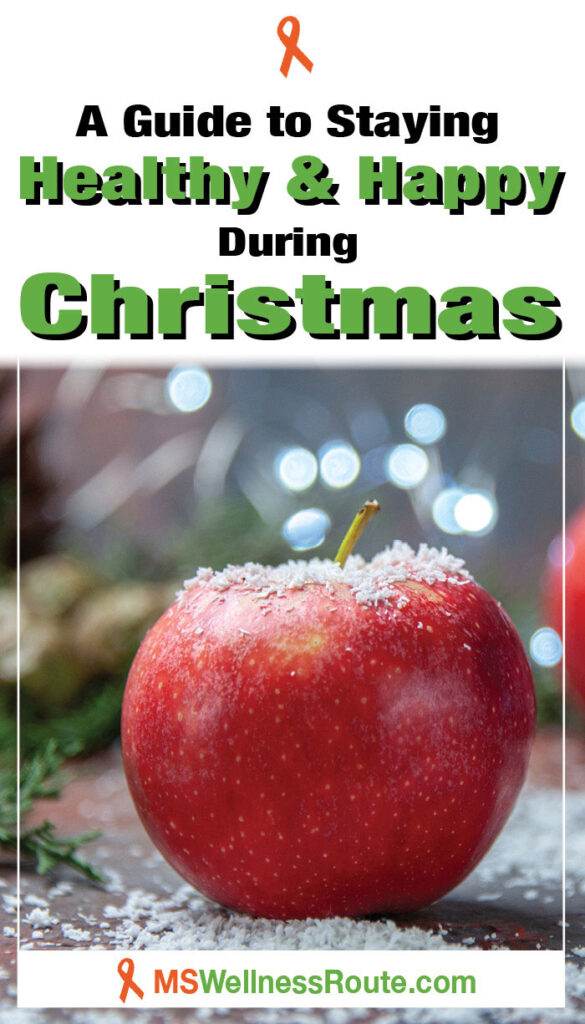 Red apples and cinnamon sticks with overlay: Staying Healthy and Happy During Christmas