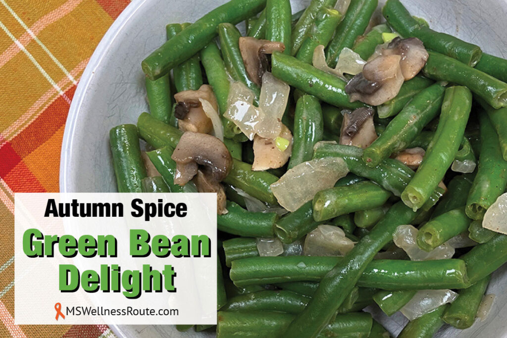 A bowl of green beans, onions, and mushrooms with overlay: Autumn Spice Green Bean Delight