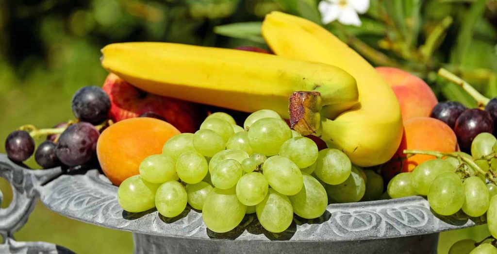 Different colored fruit in a bowl.