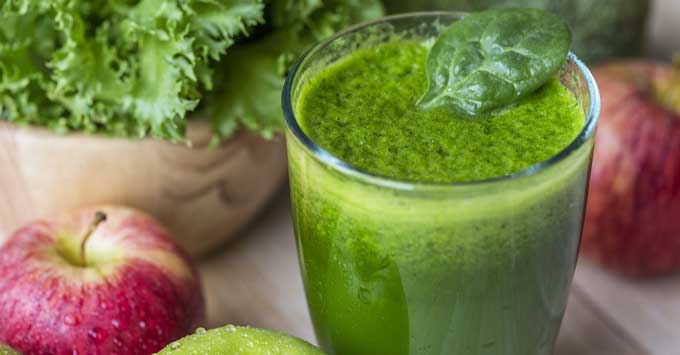 A green smoothie and apples.