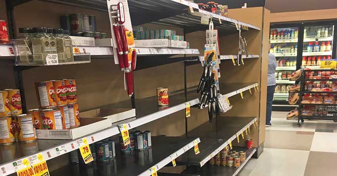 Empty grocery store shelves.