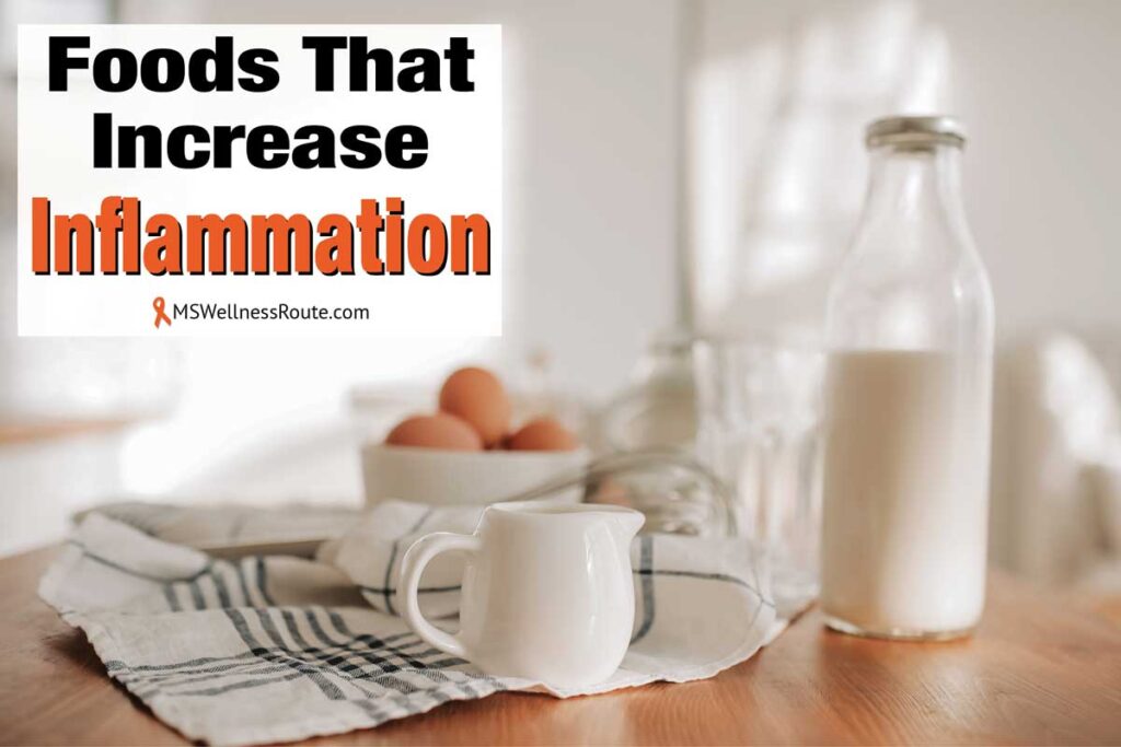 Bottle of milk, eggs, and coffee creamer mug with overlay: Foods That Increase Inflammation