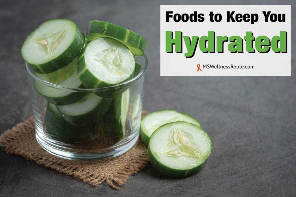 Fresh cucumbers sliced on dark background with overlay: Foods to Keep You Hydrated.