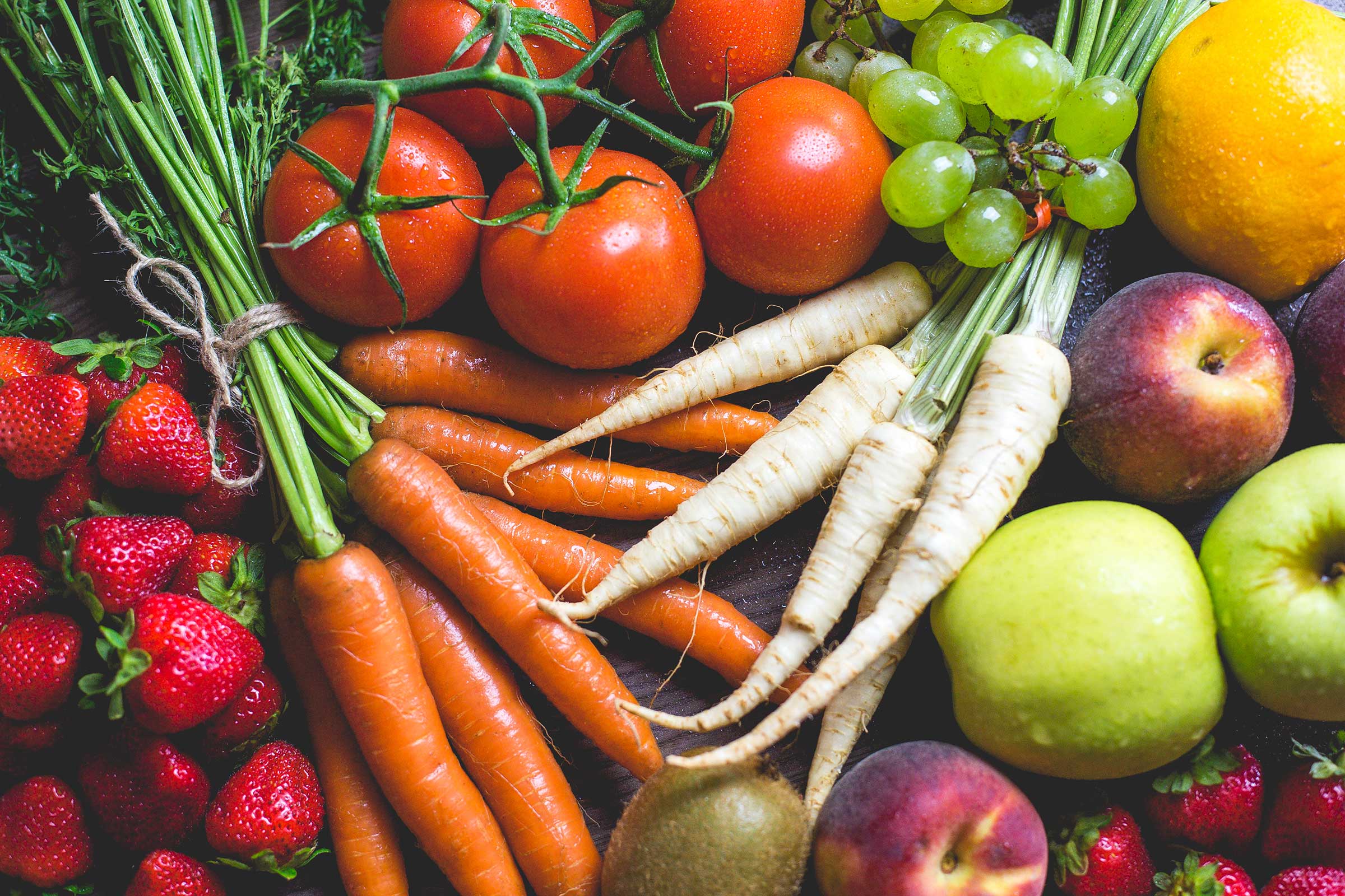 Looking down at many fruits and vegetables.