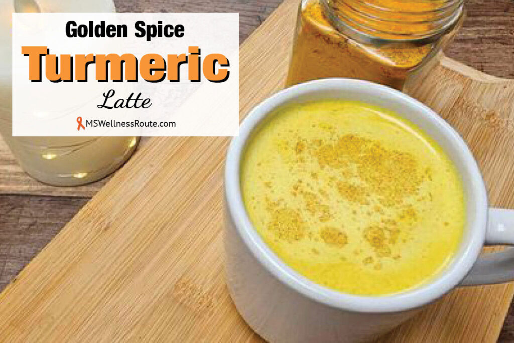 Cup of turmeric milk on cutting board with overlay: Golden Spice Turmeric Latte