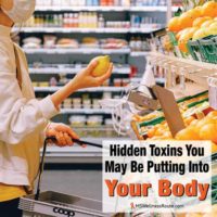 Woman wearing mask buying holding fruit in grocery store with overlay: Hidden Toxins You May Be Putting Into Your Body