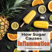 A pineapple, citrus fruits and popsicles laying on table with overlay: How Sugar Causes Inflammation