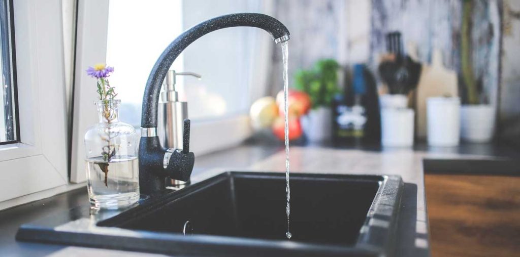 Water running rom kitchen faucet.