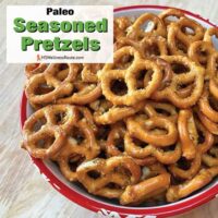 Bowl of seasoned pretzels with overlay: Paleo Seasoned Pretzels