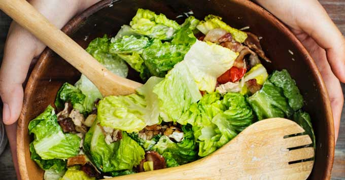 A healthy salad adds fiber to help feed the probiotics in your gut.