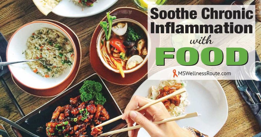 A table full of food with overlay: Soothe Chronic Inflammation with Food