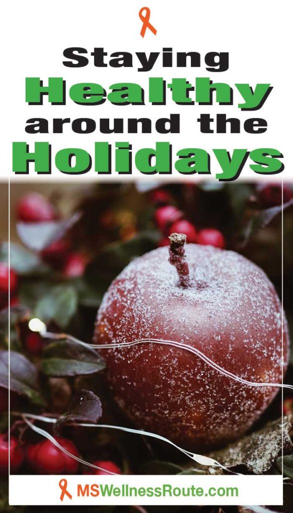 Holly berries and apple with headline: Staying Healthy Around The Holidays