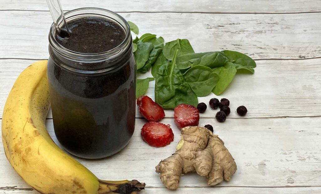 Strep Detox Smoothie in glass jar and ingredients around it.