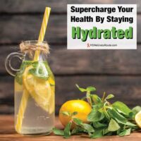 Lemon water in glass bottle with overlay: Supercharge Your Health By Staying Hydrated