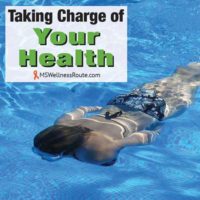 Woman swimming underwater with overlay: Taking Charge of Your Health