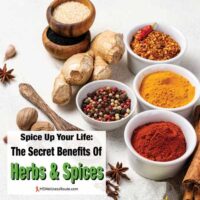 Herbs and spices in bowls on table with overlay: Spice Up Your Life: The Secret Benefits Of Herbs & Spices