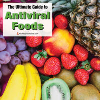 Looking down at a variety of fruit with overlay: The Ultimate Guide to Antiviral Foods