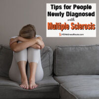 Sad woman holding legs with overlay: Tips for People Newly Diagnosed with MS