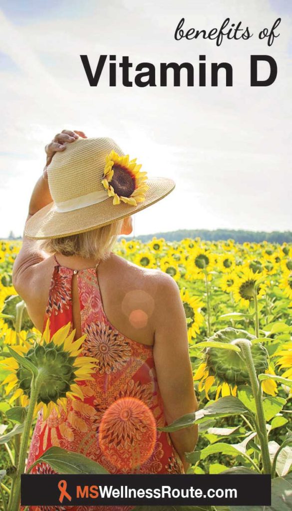 Woman standing in a field of sunflowers with header: benefits of vitamin D