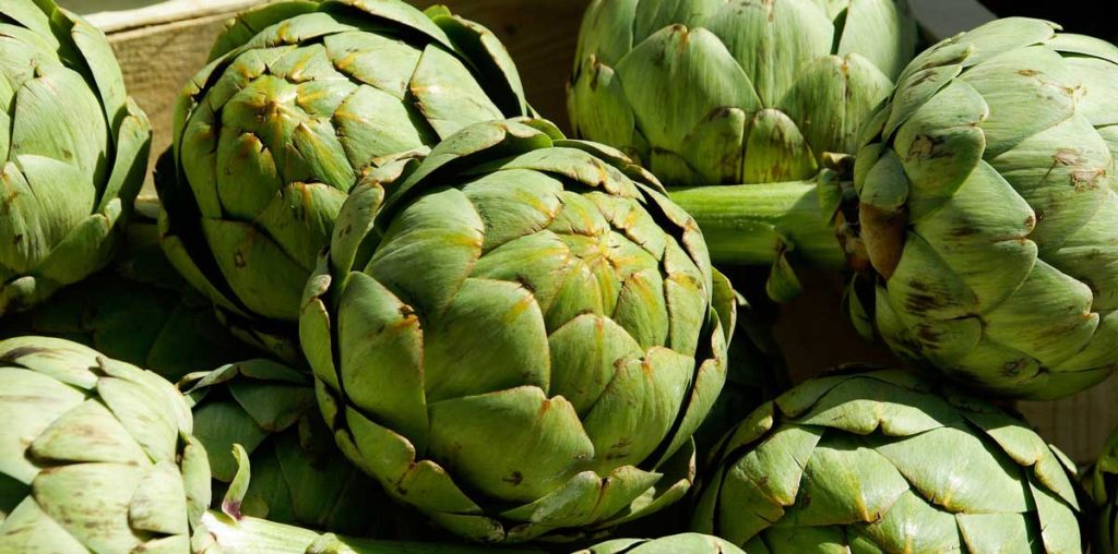 Artichokes in a wooden crate.