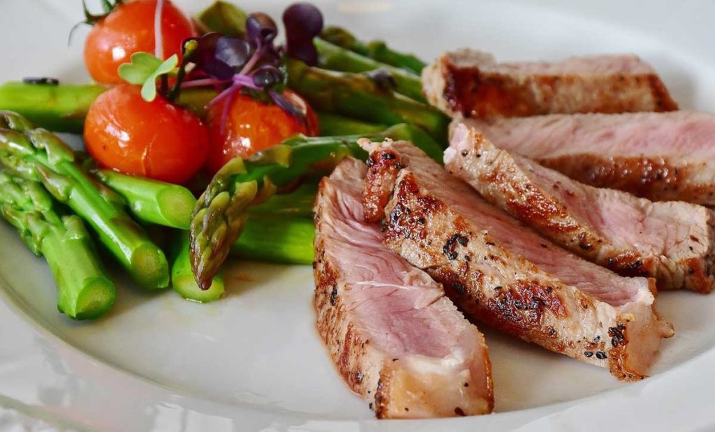 Asparagus, tomatoes, and pork steak.