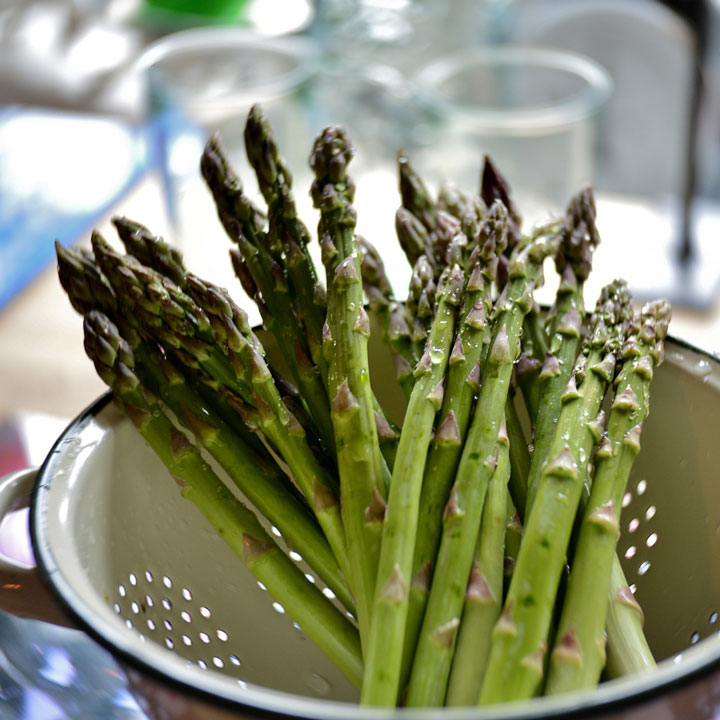 Asparagus in a colander.