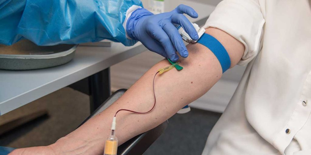 Patient giving blood sample.