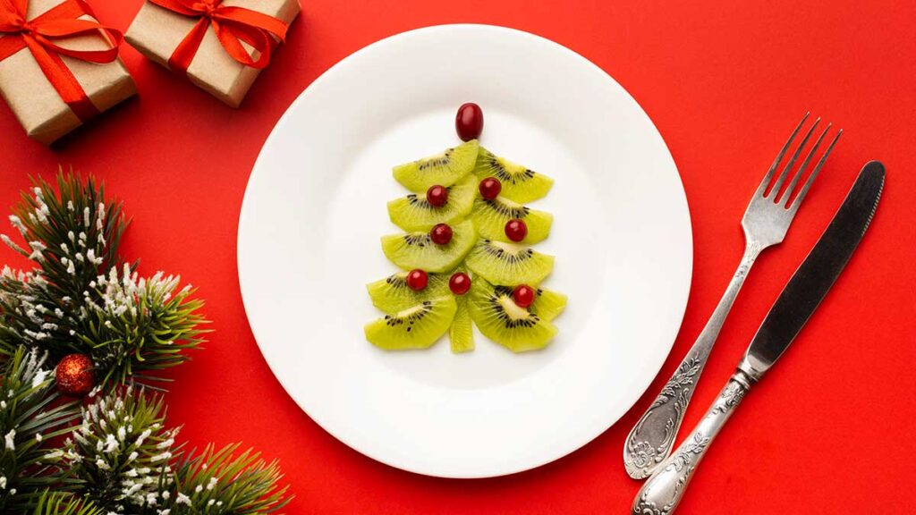 Christmas tree made with kiwi and pomegranate seeds.