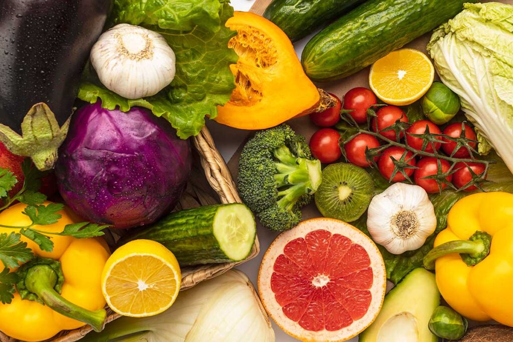 Flat lay of assortment of fresh vegetables which help heal MS naturally.