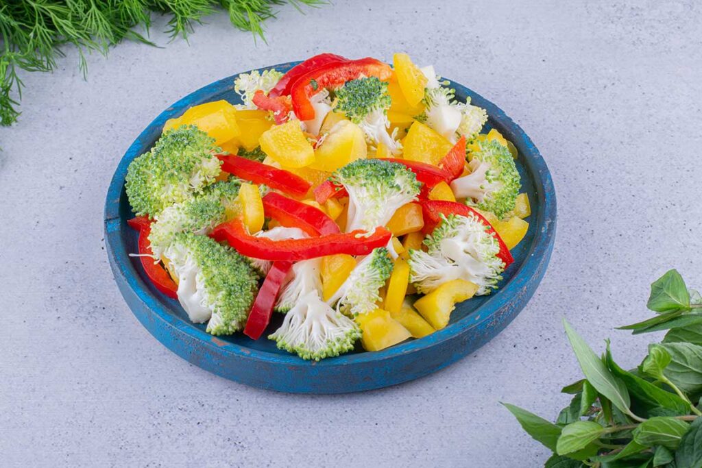 Veggies on in a dish on marble background.