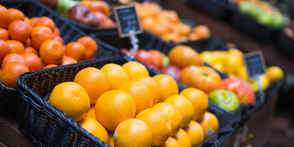 Fruit and veggies at a farmers market.