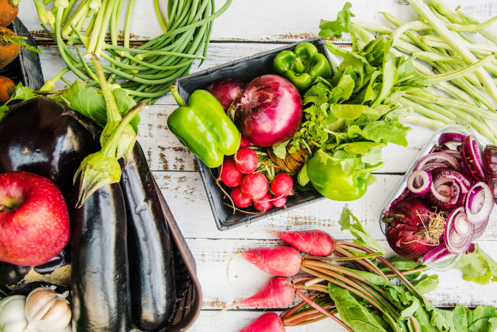 Healthy fruits and vegetable on wooden table.