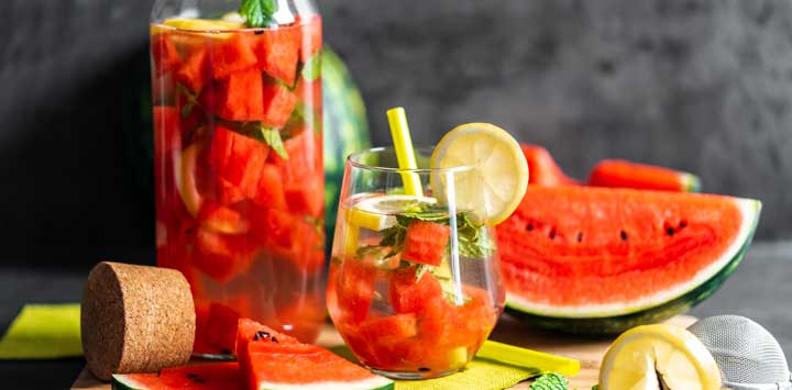 Watermelon with water with melon and lemon pieces.