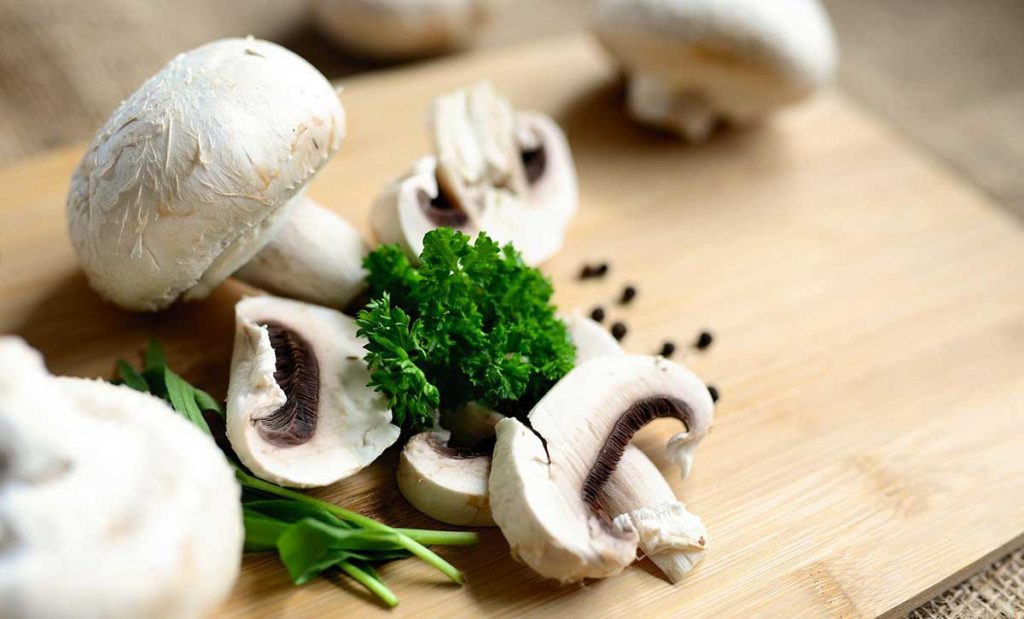 Mushrooms on cutting board.