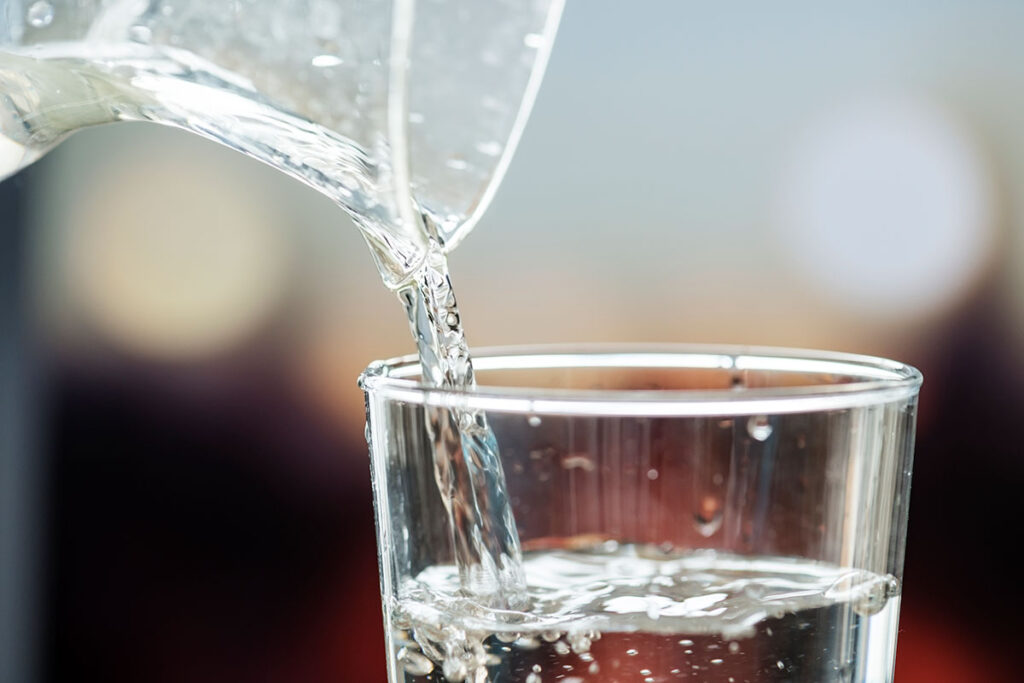 Pouring water into a glass.