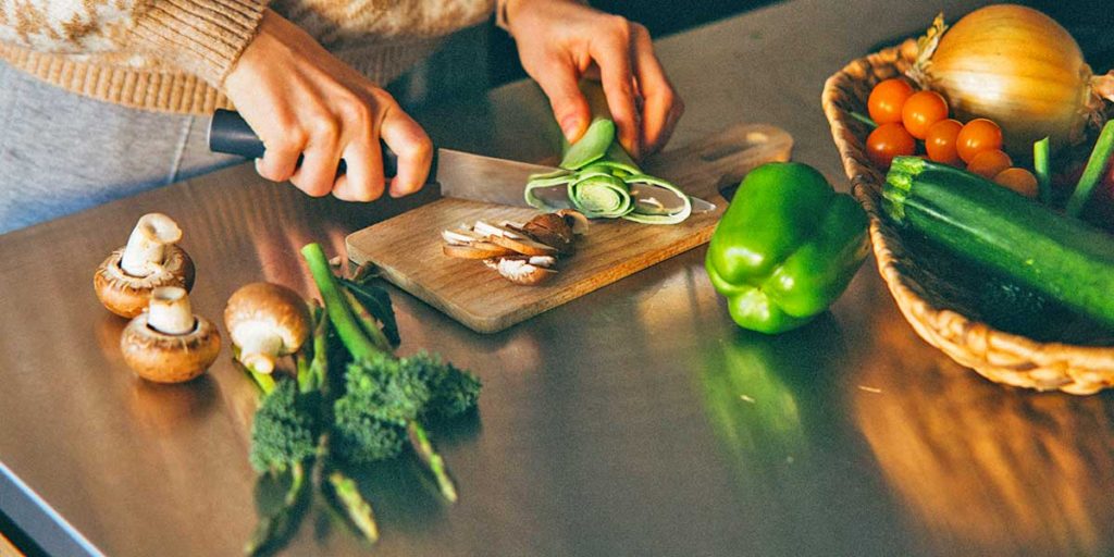 Cutting and preparing vegetables.