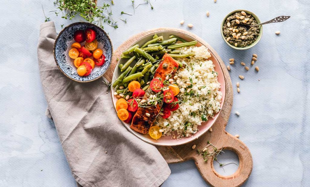 Anti-inflammatory diet with salmon, veggies, and cauliflower rice.