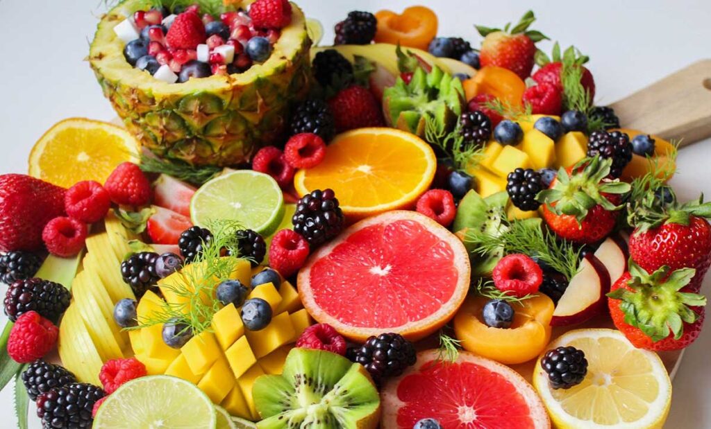 Sliced fruits on a tray.