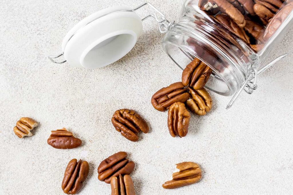 Top view of jar with walnuts,