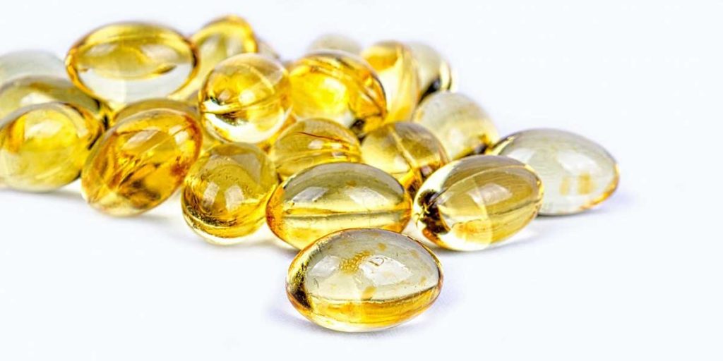 Vitamin D supplements on a white background.