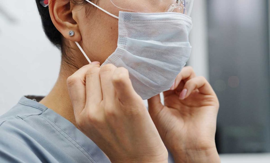 Woman wearing a face mask.