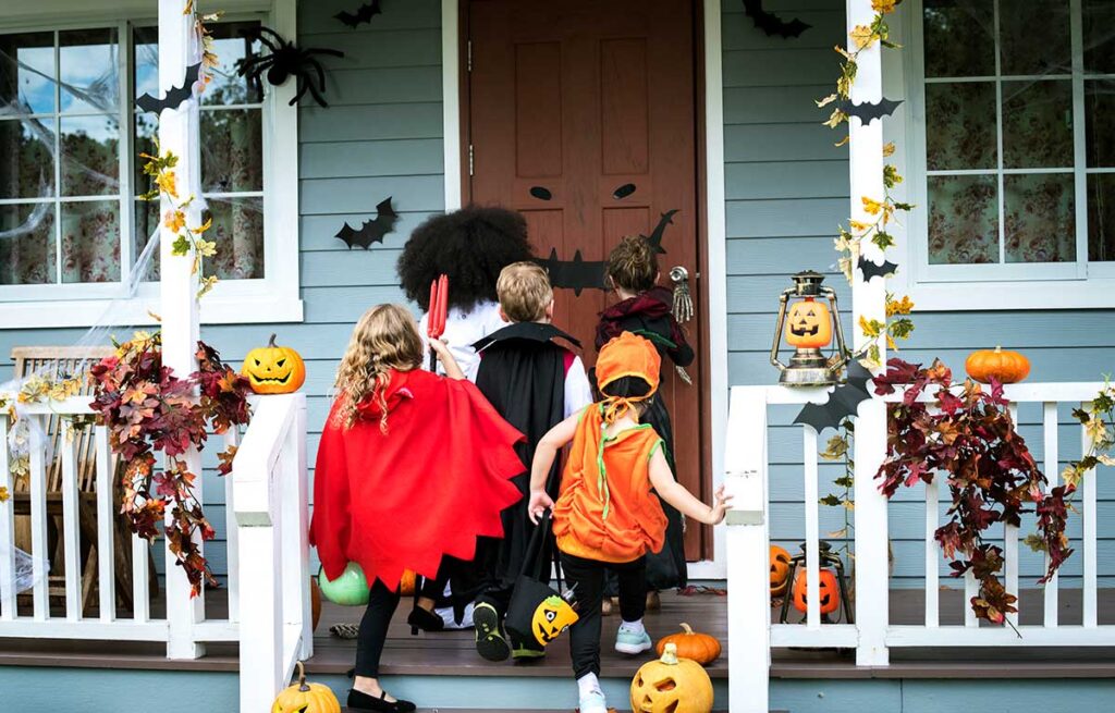 Kids trick-or-treating knocking on door.